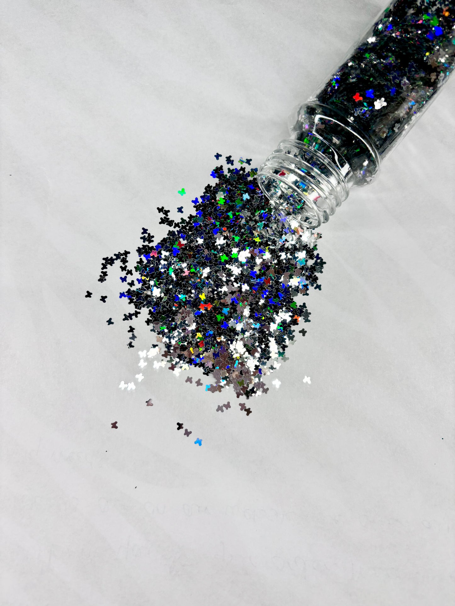 Silver holographic butterfly shaped glitter.